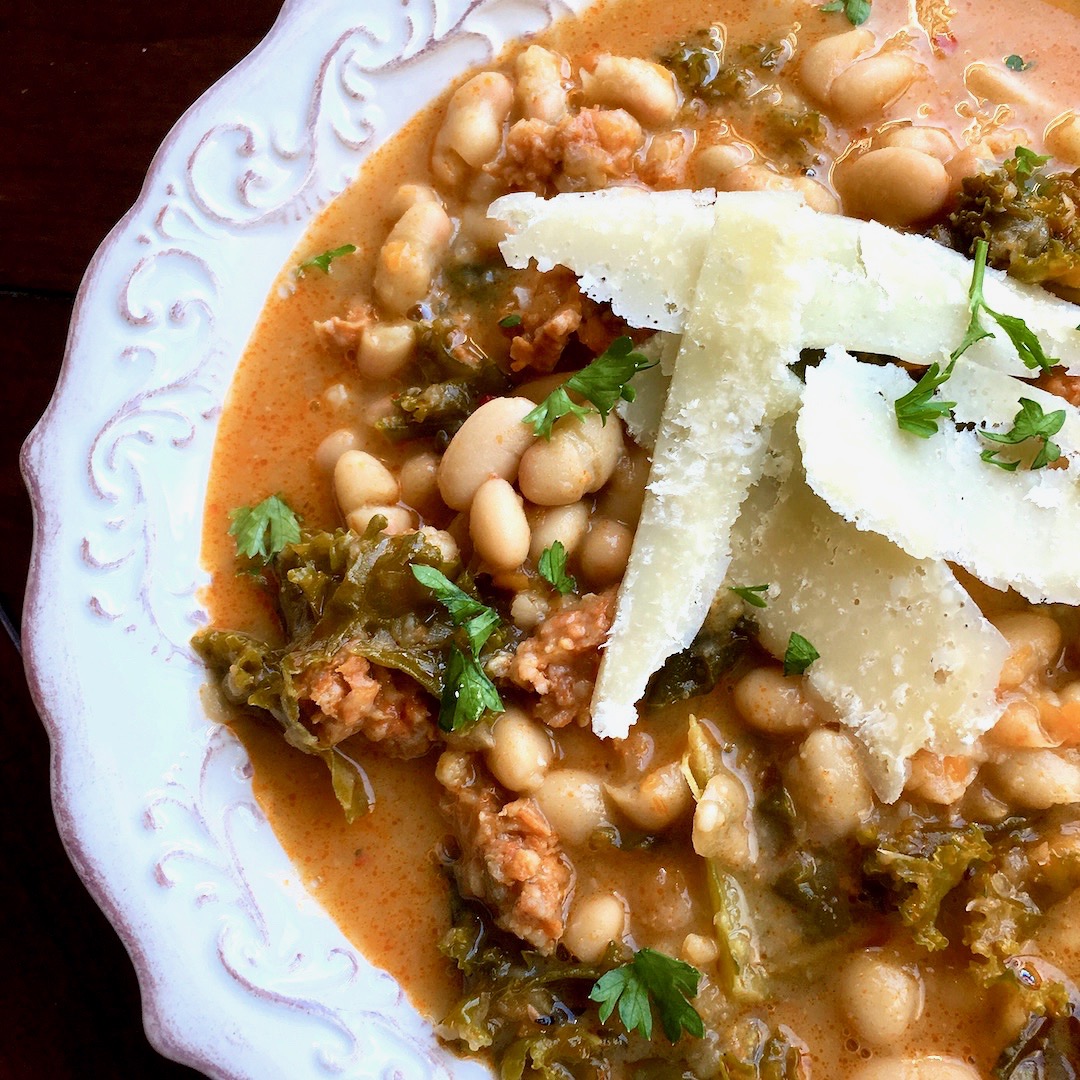 This delicious Dutch Oven White Bean, Spicy Sausage and Kale Soup is pure comfort food for the fall and winter seasons.