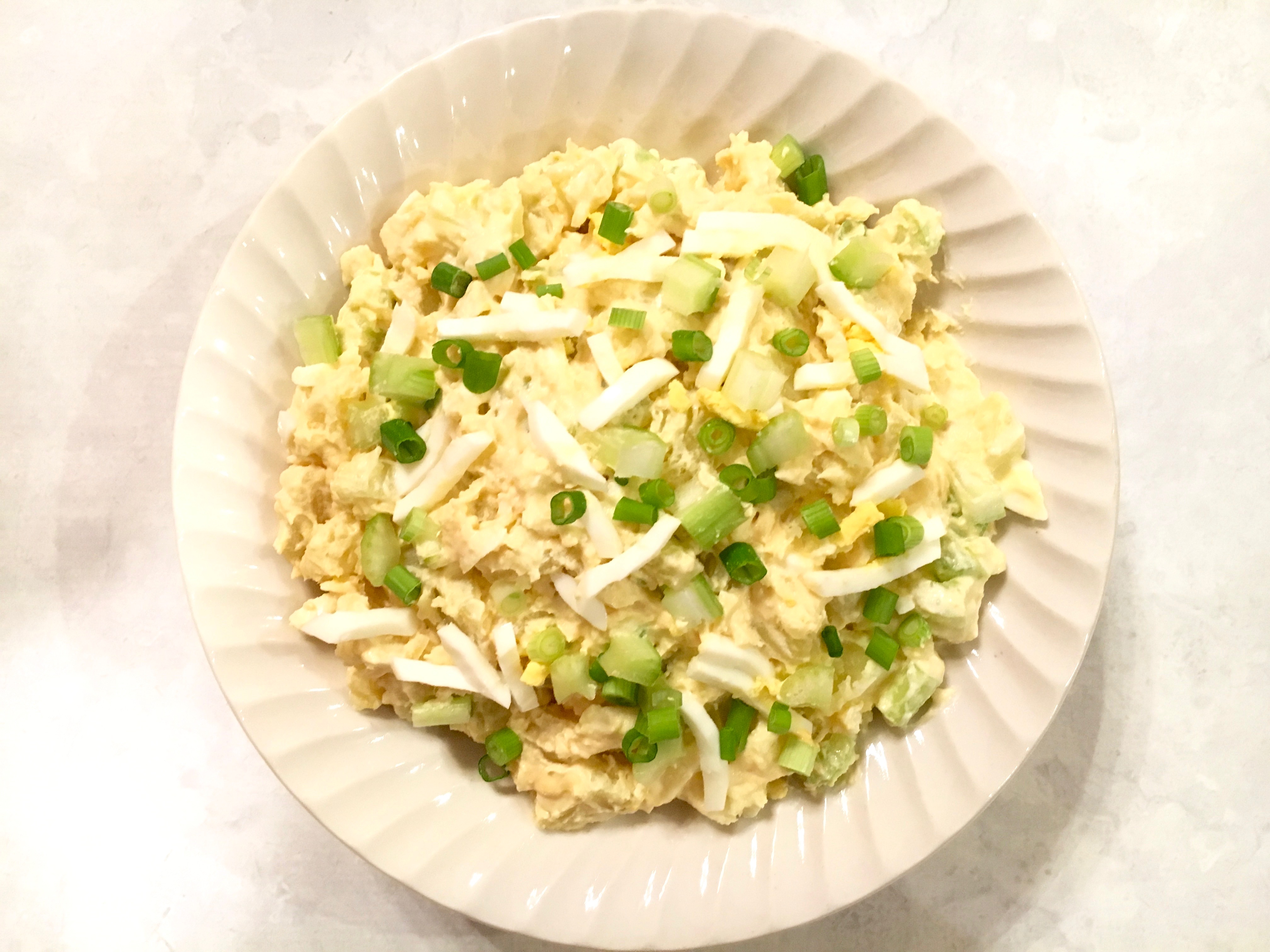 This Easy No Mayo Potato Salad Recipe is will become a favorite at your next picnic, BBQ or potluck. This potato salad is elevated by the spicy addition of Dijon mustard. Sour cream replaces the mayonnaise and the addition of egg, celery, green onions and dill pickle make this a zesty potato salad worthy of your next gathering.