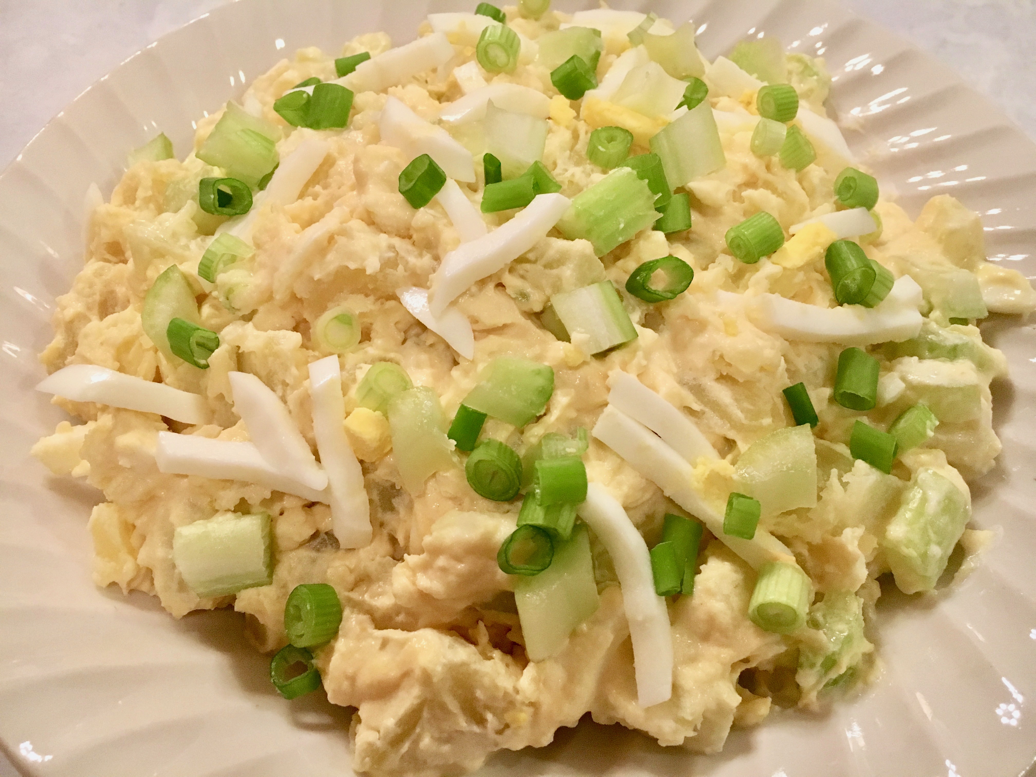 This Easy No Mayo Potato Salad Recipe is will become a favorite at your next picnic, BBQ or potluck. This potato salad is elevated by the spicy addition of Dijon mustard. Sour cream replaces the mayonnaise and the addition of egg, celery, green onions and dill pickle make this a zesty potato salad worthy of your next gathering.
