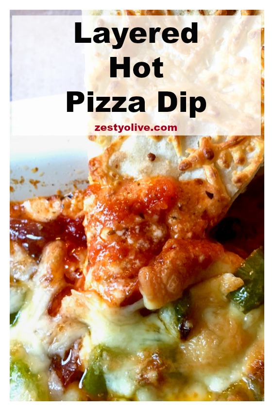 This easy Layered Hot Pizza Dip is perfect for game day parties or anytime you need a cheese fix! Packed with a variety of cheeses, plus pepperoni, pizza sauce, green peppers and onions, this dip is perfect for Super Bowl parties and beyond.