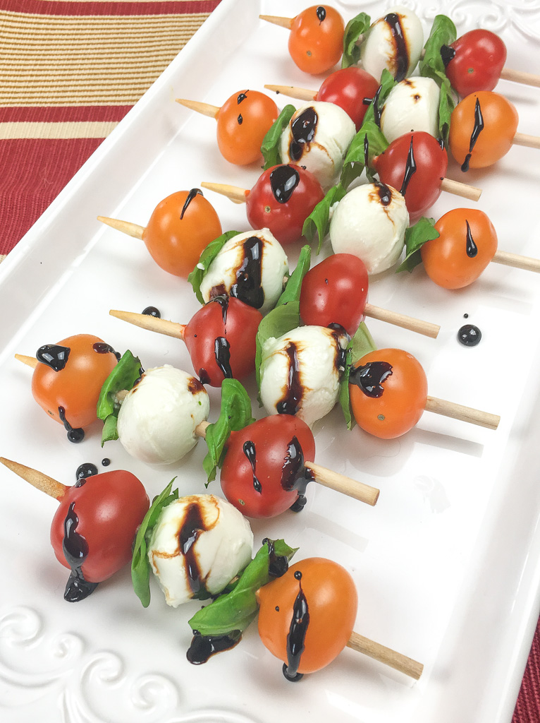 This quick and easy appetizer is sure to be a hit at your next party. Traditional elements of a Caprese salad, tomato, basil and mozzarella are arranged on a short skewer for an instant and savory appetizer.